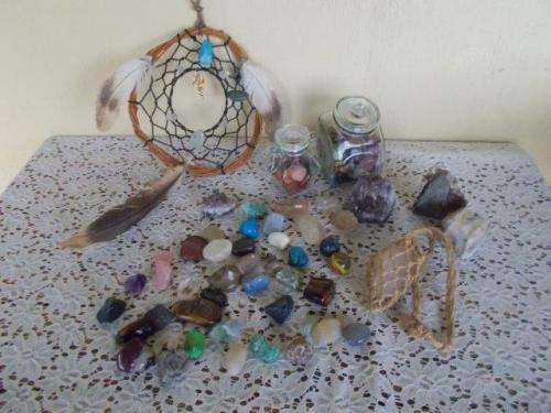 A collection of semi perious stones and a dream catcher