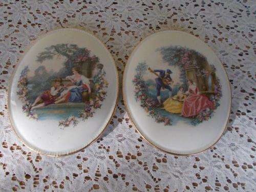 Two beautiful porcelain romantic scene wall plaques