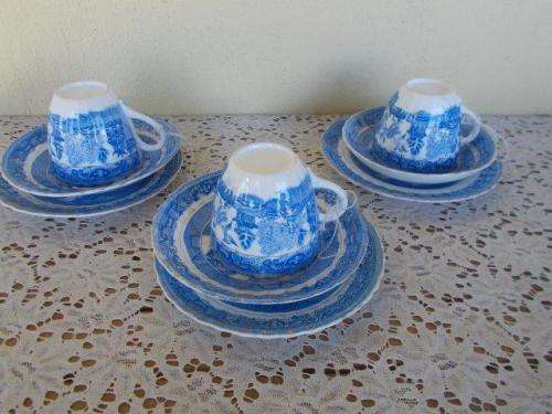 A set of three blue and white vintage blue and white willow pattern tea cup trios