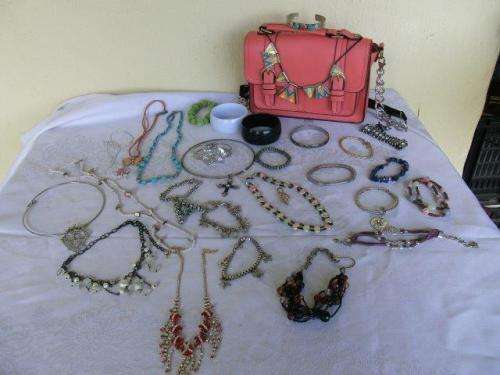 A selection of costume jewerley and a bag