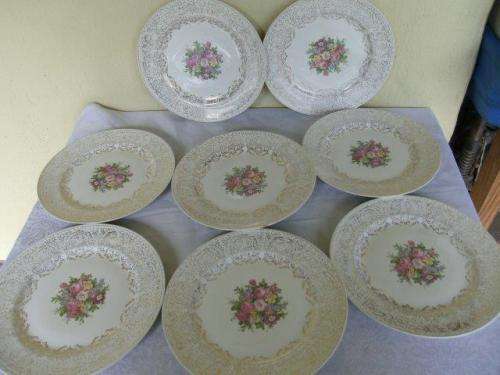 A set of eight stunning floarl eggshell georain dinner plates