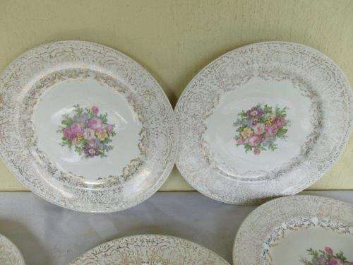 A set of eight stunning floarl eggshell georain dinner plates