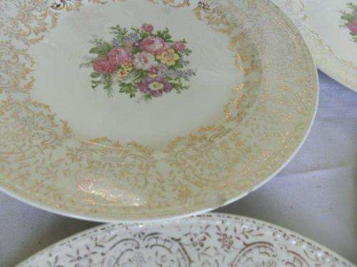 A set of eight stunning floarl eggshell georain dinner plates