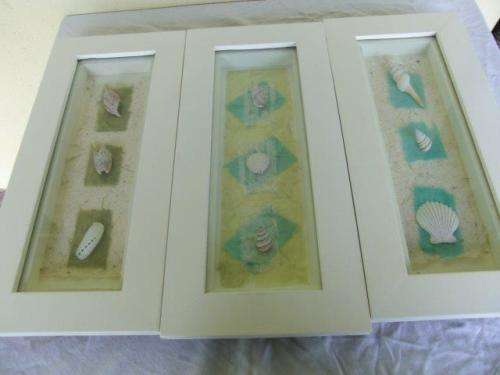 A set of three very nice and decorative framed sea shell wall hangings