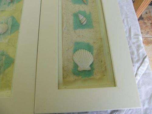 A set of three very nice and decorative framed sea shell wall hangings