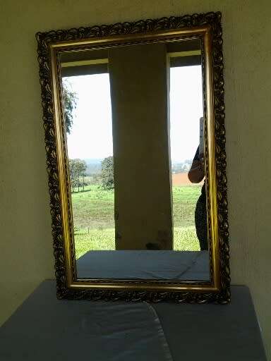 large gold orante framed wall mirror