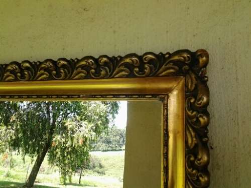 large gold orante framed wall mirror