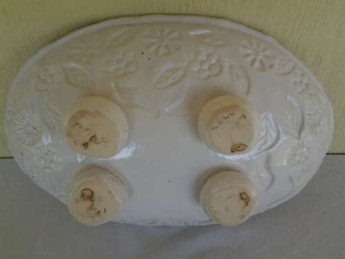 decorative white bowl filled with porcelain blue balls