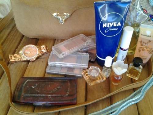 a nice ladies job lot selection of leather bag and some make up and perfume lot