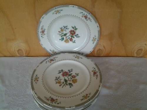 A set of eight stunning Royal Doulton porcelain dinner plates