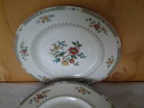 A set of eight stunning Royal Doulton porcelain dinner plates