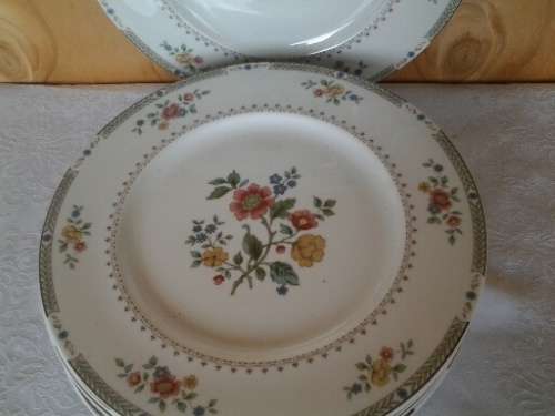 A set of eight stunning Royal Doulton porcelain dinner plates