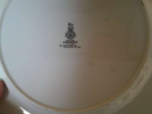 A set of eight stunning Royal Doulton porcelain dinner plates