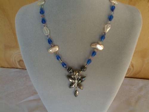 well made blue glass and pearl beaded necklace with butterfly pendant