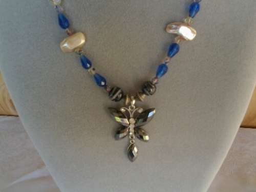 well made blue glass and pearl beaded necklace with butterfly pendant