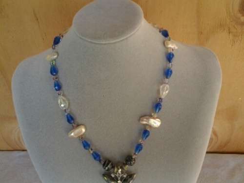 well made blue glass and pearl beaded necklace with butterfly pendant