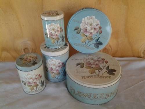 A collection of some pretty rose scene vintage tins