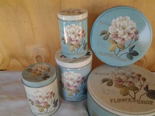 A collection of some pretty rose scene vintage tins