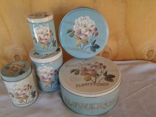 A collection of some pretty rose scene vintage tins