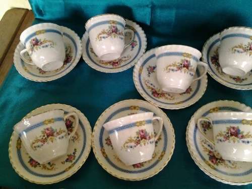 A stunning lot of eleven porcelain Johnson brothers small pretty coffee cups and saucers