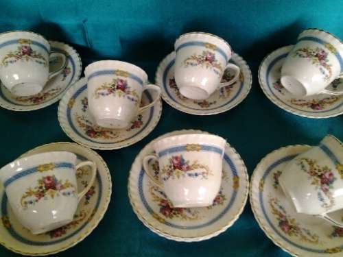 A stunning lot of eleven porcelain Johnson brothers small pretty coffee cups and saucers