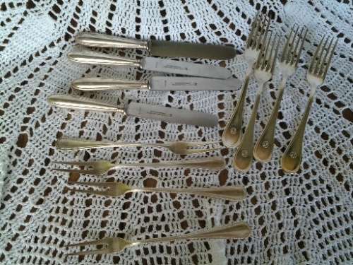 assorted lot of vintage cutlery , knifes and forks and pickle forks lot