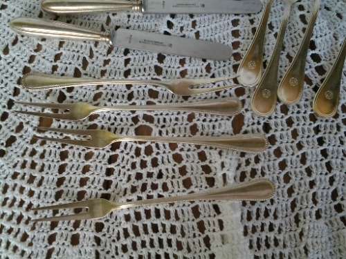 assorted lot of vintage cutlery , knifes and forks and pickle forks lot