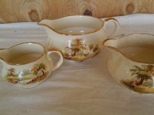 a set of three hayride pattern porcealin Alfred meakin cream jugs