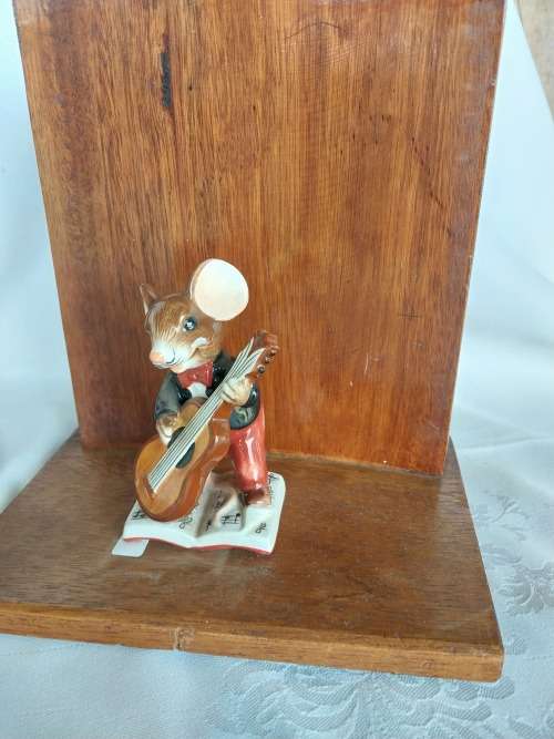 A pair of stunning wooden book ends with mouse figurines