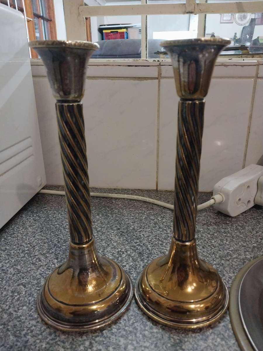 A pair of sliver plated candle sticks