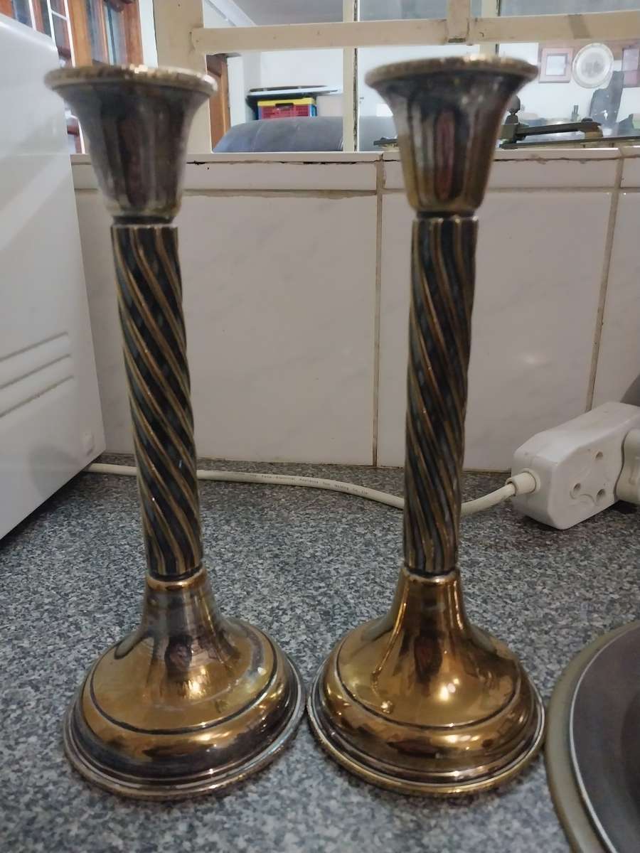 A pair of sliver plated candle sticks