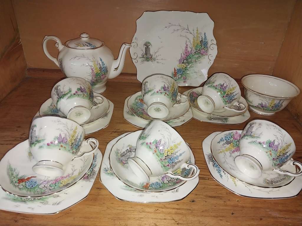 Vintage part Tuscan procelain tea set with a garden scene