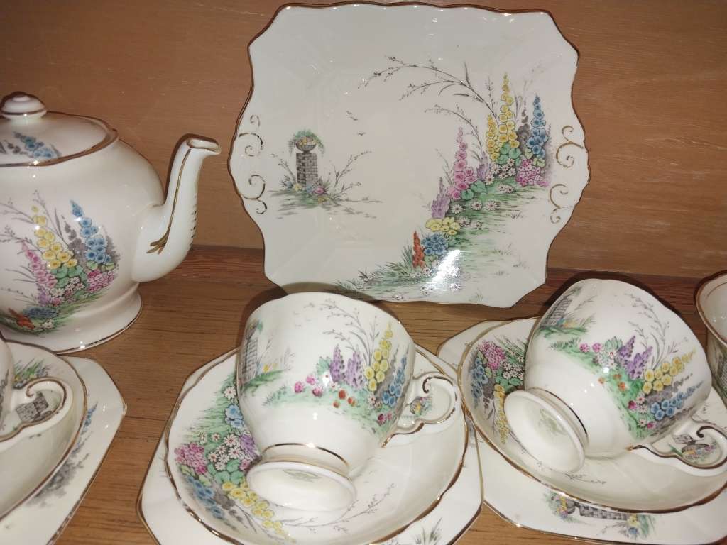 Vintage part Tuscan procelain tea set with a garden scene