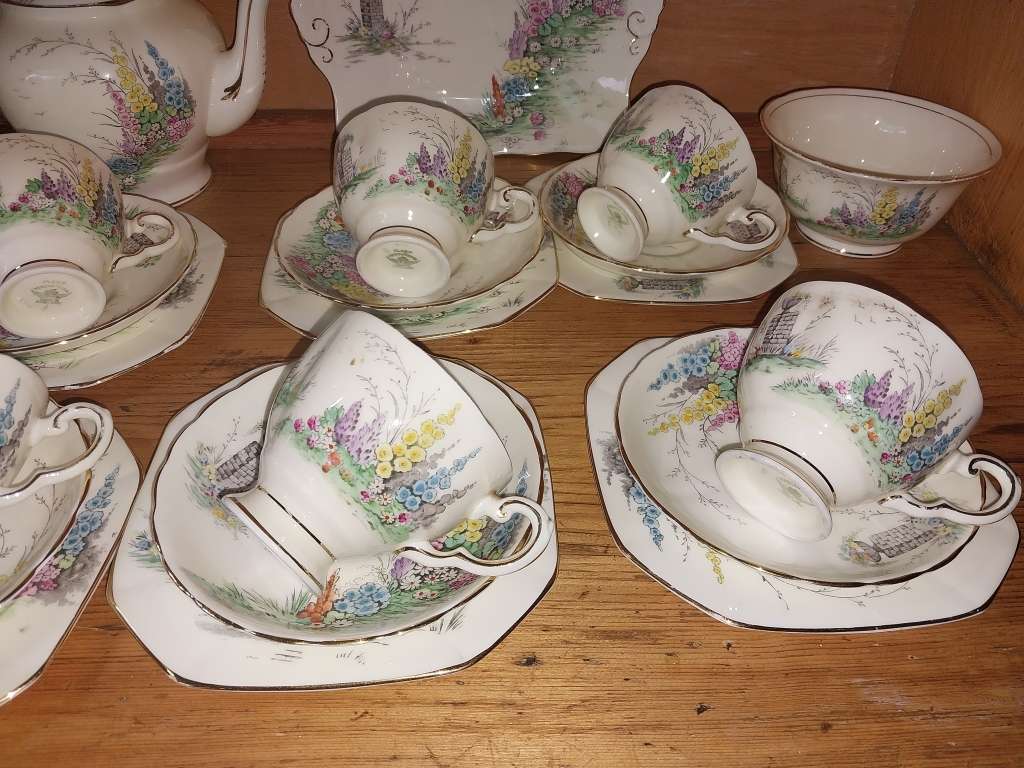 Vintage part Tuscan procelain tea set with a garden scene