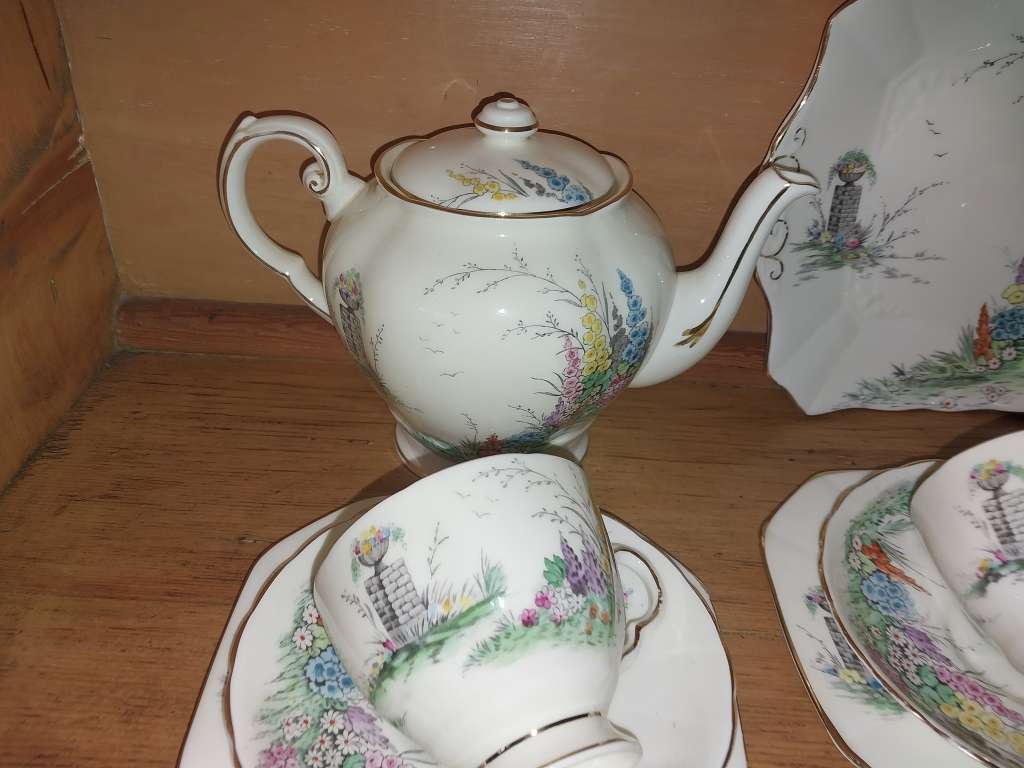 Vintage part Tuscan procelain tea set with a garden scene