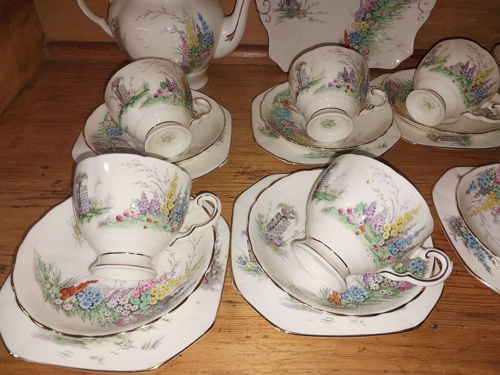 Vintage part Tuscan procelain tea set with a garden scene