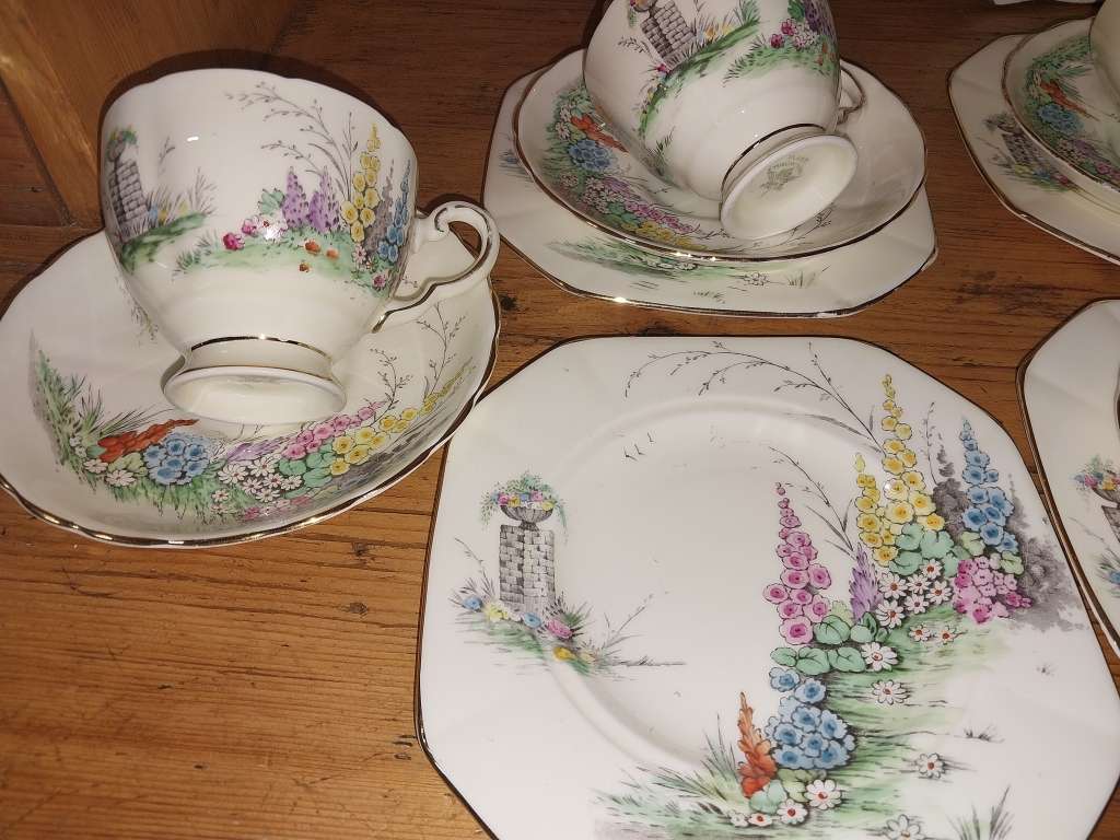 Vintage part Tuscan procelain tea set with a garden scene