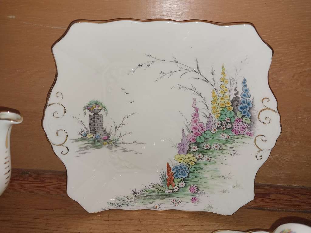 Vintage part Tuscan procelain tea set with a garden scene