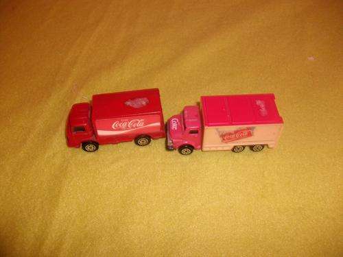 two coke  trucks