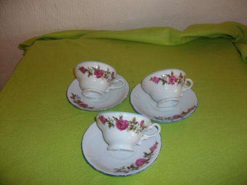 pretty set of three tea cups and saucers