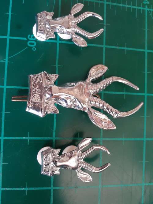 Large Chrome Bokkop and collar badges pair