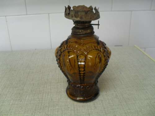 (oct17)  A VINTAGE AMBER PRESS GLASS made in HONG KONG OIL LAMP - 17cm high, base 7cm wdt pt cir 31c