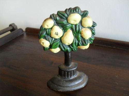 A LOVELY CAST IRON YELLOW LEMON TREE DOOR STOPPER