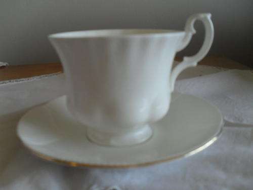 a ROYAL ALBERT REVERIE CUP with a ROYAL ALBERT CORONET SAUCER