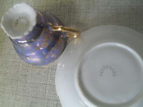 (or)  GORGEOUS VERSAILLES ROMANTIC SCENE CUP AND SAUCER DUO. - saucer 12cm arcoss cup 5.5cm tall