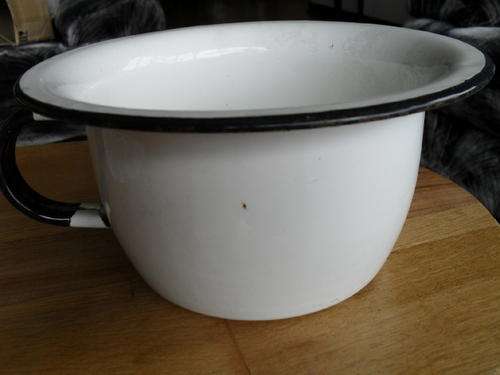 A VINTAGE WHITE Enamel potty WITH BLACK TRIMM