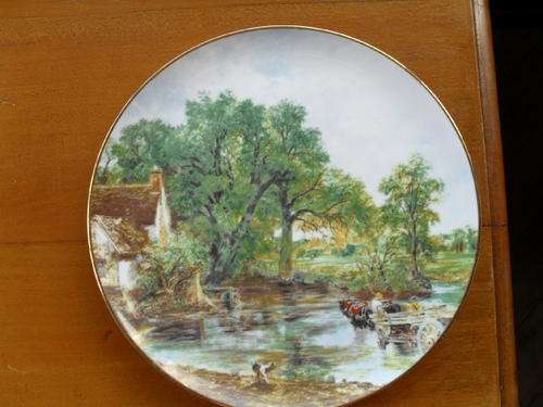 A wall hanging plate copy of  the 'The Hay Wain -by John constable on.Souvenir -The National Gallery