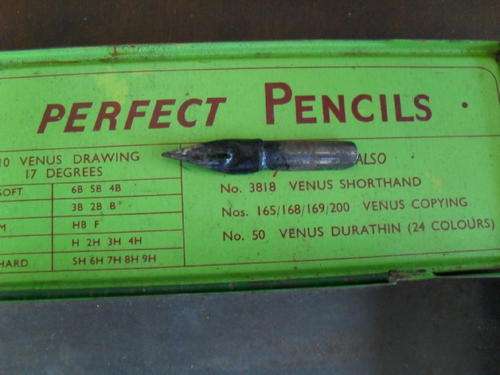 A VENUS TIN AND VINTAGE WRITTING NIB.