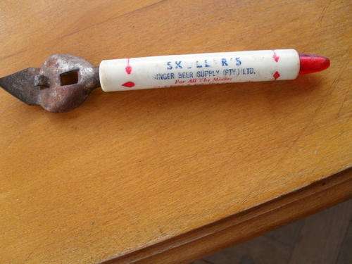 A VINTAGE "SKULLERS OPENER" BOTTLE TOP OPENER  15CM LONG  GINGER BEER SUPPLY (PTY)LTD
