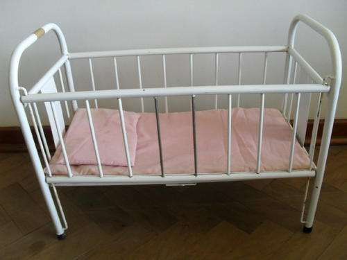 A VINTAGE WHITE METAL DOLLS COT